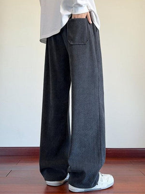 Men's gray textured wide leg sweatpants with a herringbone pattern and a back pocket.
