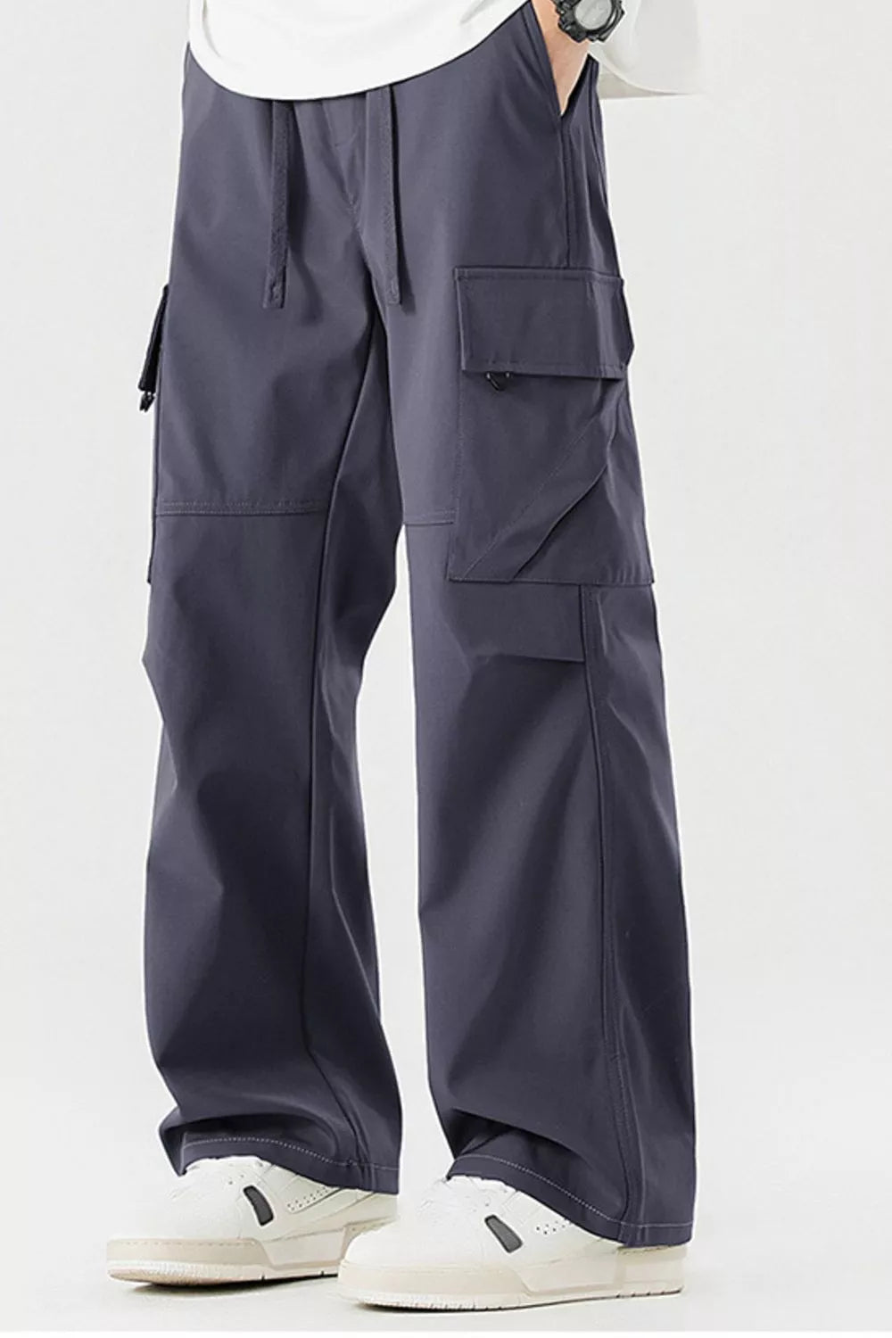 Dark gray cargo pants for men with multiple pockets and drawstring waist.