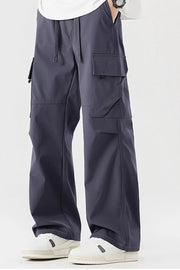Dark gray cargo pants for men with multiple pockets and drawstring waist.