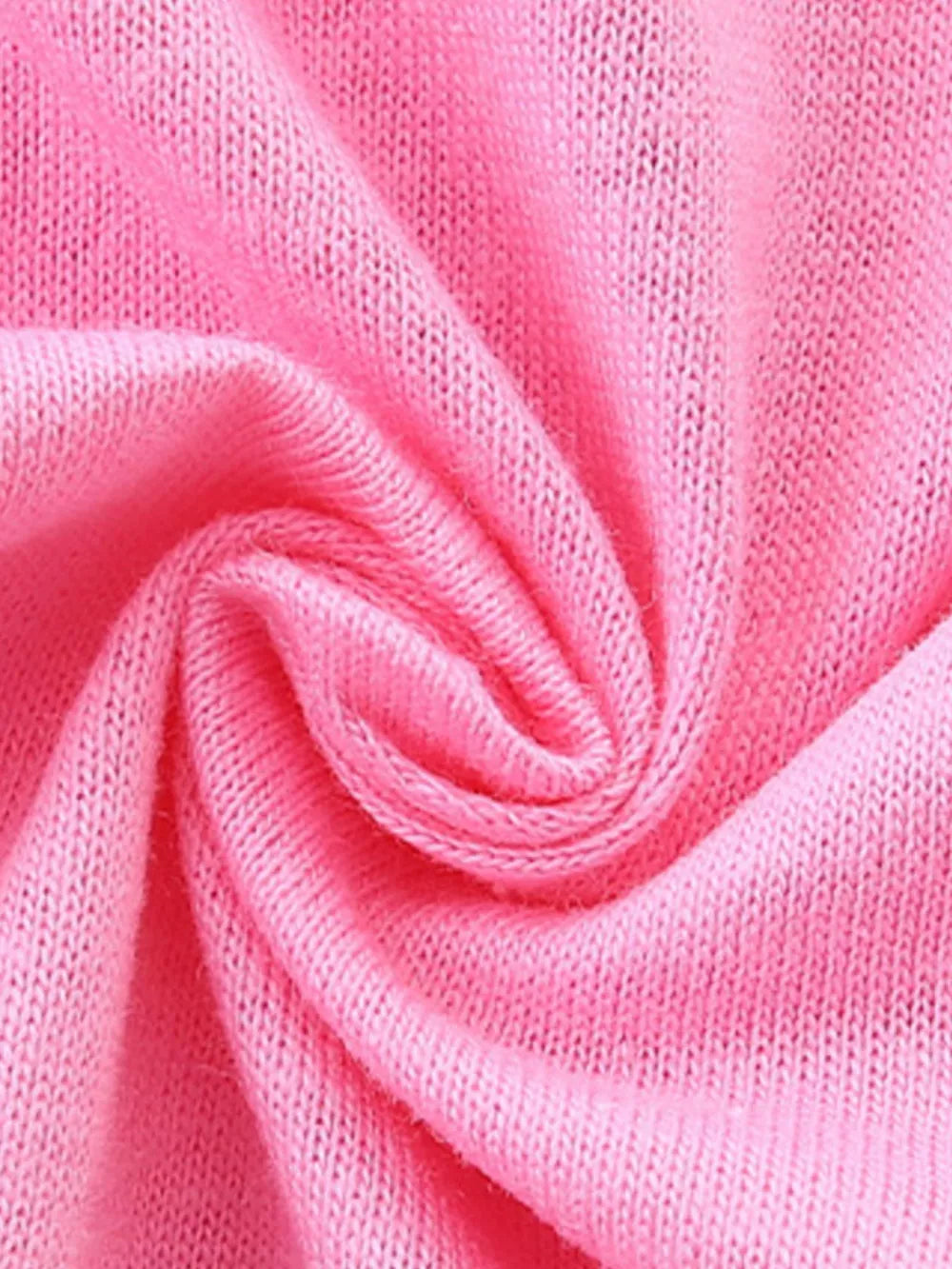 Pink cotton t-shirt fabric with a close-up view of the knit texture.