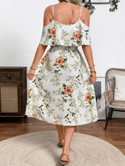 Floral print cold shoulder dress with ruffled neckline and spaghetti straps.