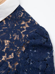 Navy lace midi dress with white collar and puff sleeves detail.