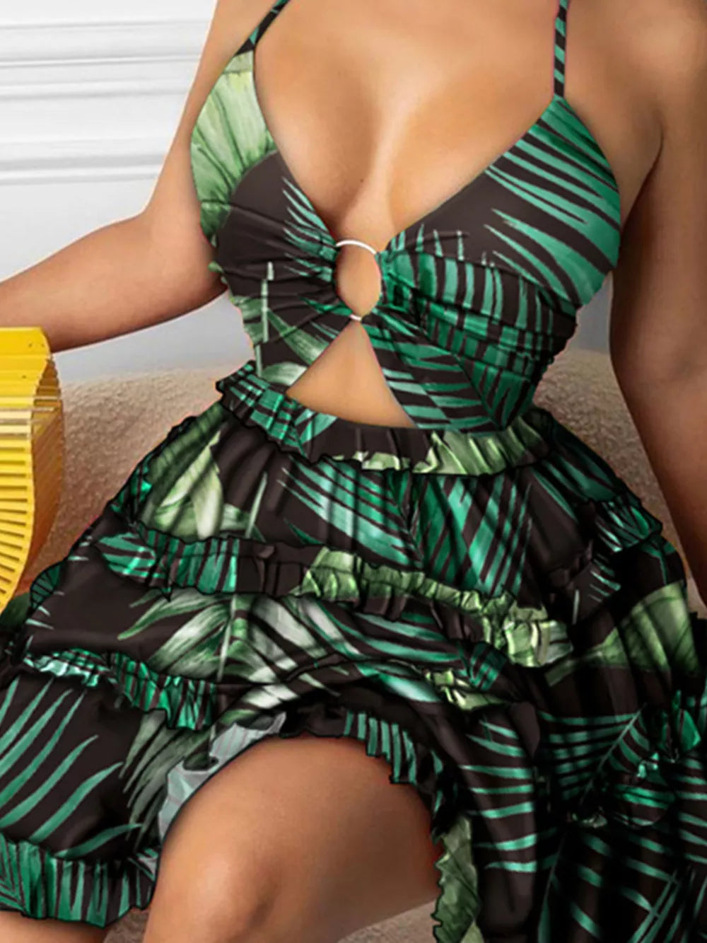 Halter mini dress with cutout and ring detail in a tropical leaf print.