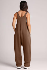 Relaxed fit chocolate brown jumpsuit with oversized pockets and wide legs.