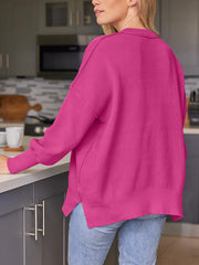 Ribbed-knit relaxed fit sweater in deep rose with a collared neckline and side slits.