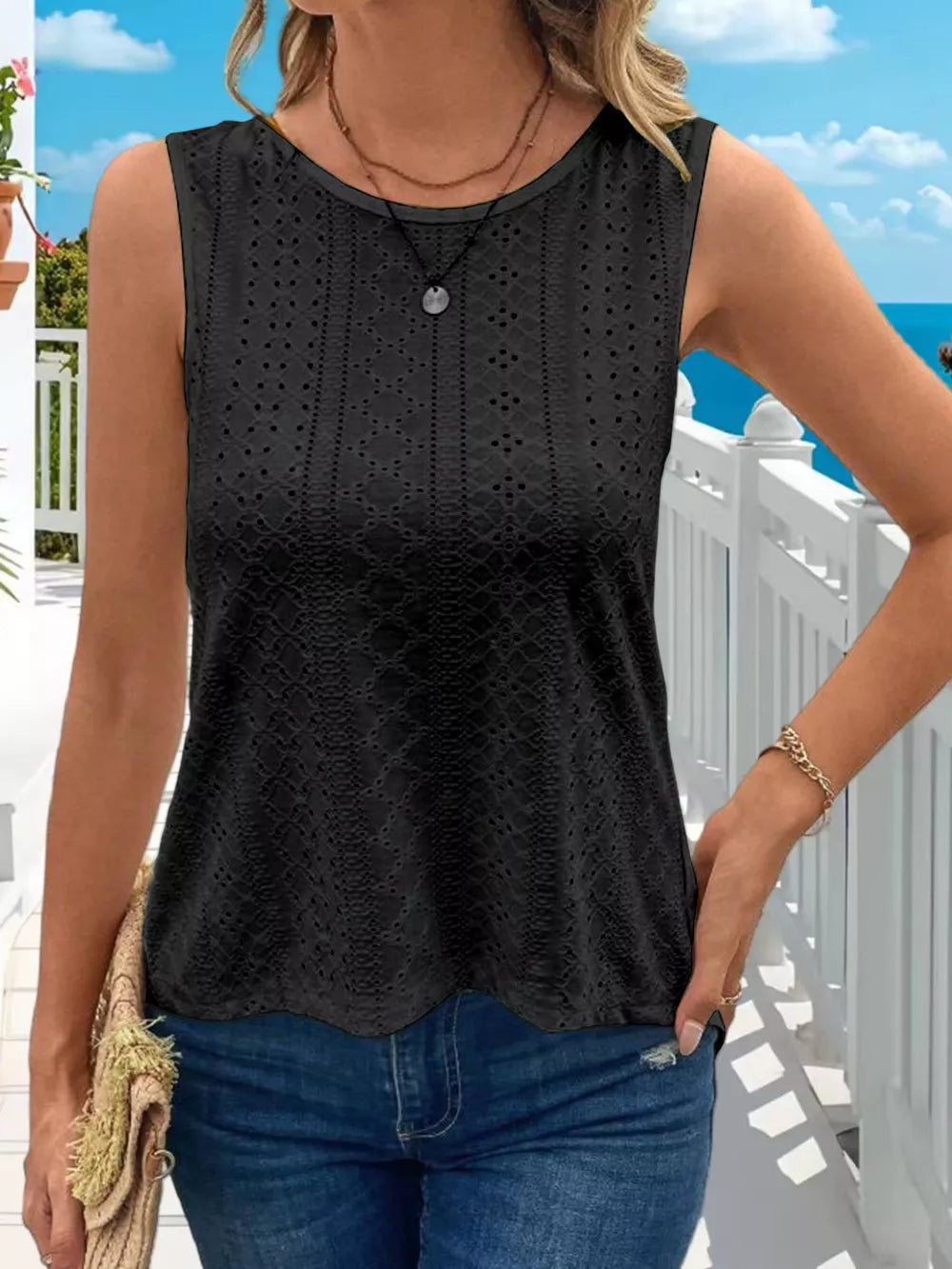 Black openwork knit tank top with crew neck and scalloped hem.
