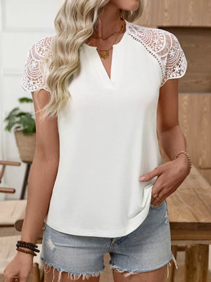 White cap sleeve t-shirt with delicate lace sleeves and V-neck.