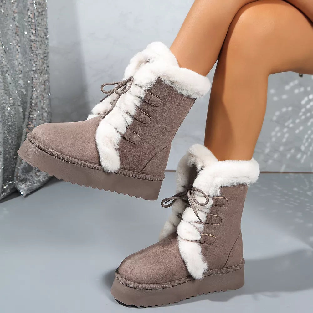 Brown suede lace-up platform boots with white faux fur trim and lining.