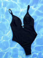 Black one-piece swimsuit with deep V-neck and gold ring detail at bust.