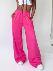 Hot Pink wide-leg lounge pants with pockets and drawstring waist.