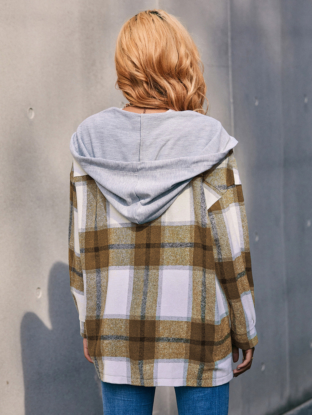 Oversized plaid shacket with hood in brown and white plaid, featuring a grey jersey hood.