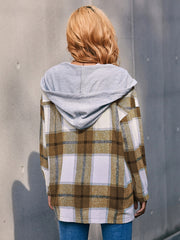 Oversized plaid shacket with hood in brown and white plaid, featuring a grey jersey hood.