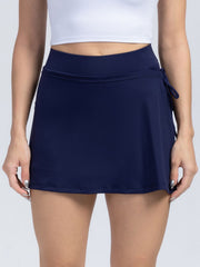 Dark blue wrap-detail skort with side tie and elastic waistband.