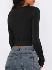 Black long sleeve ruched top with adjustable side tie detail
