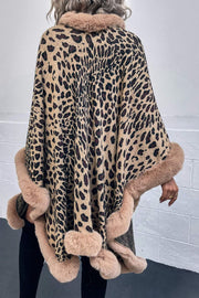 Leopard print acrylic cape with faux fur trim in beige, camel, and chocolate colors.