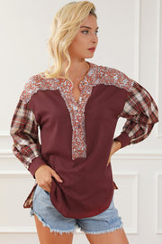 Burgundy mixed media blouse with floral yoke and plaid sleeves.