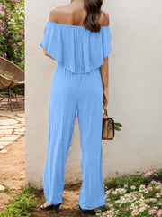 Light blue off-the-shoulder flounce jumpsuit with wide legs.