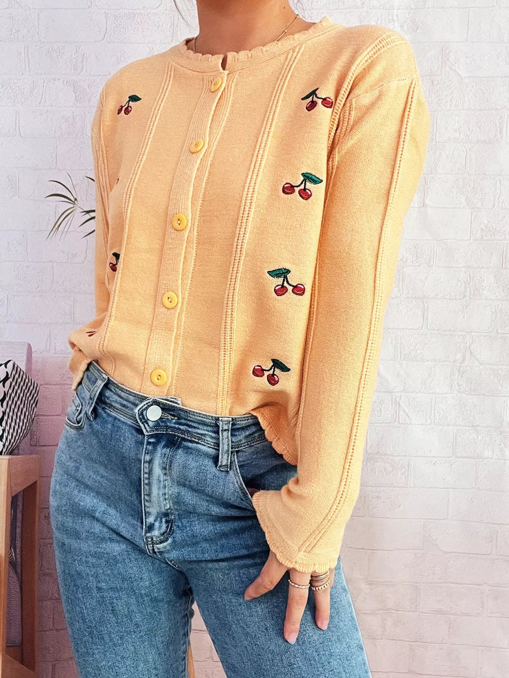 Yellow cherry embroidered button up cardigan with scalloped trim.