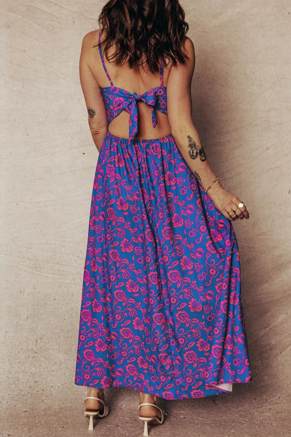 Floral maxi dress with cutout back and tie detail.