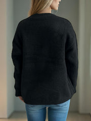 Black acrylic knit sweater with crew neck and long sleeves, showing back view.