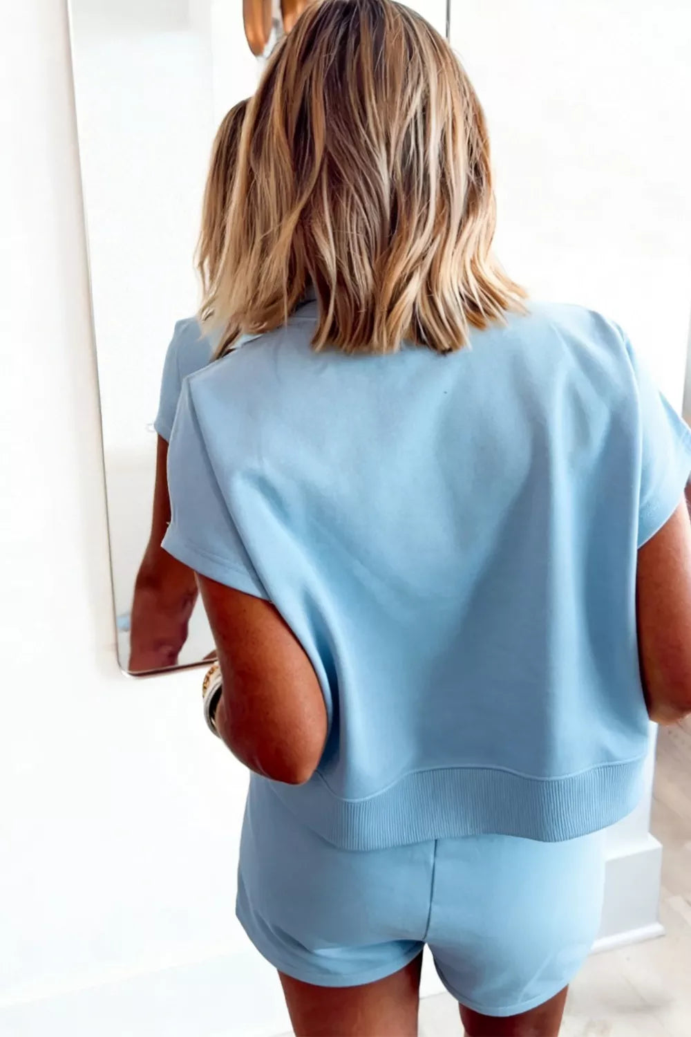 Blue cotton two-piece set with drawstring shorts and crew neck top.