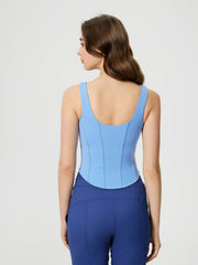 Light blue sculpted seam tank top with built-in support, scoop neck, and curved hem.