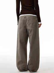 Loose fit men's jeans in coffee brown, 100% cotton, with button fly and casual styling.