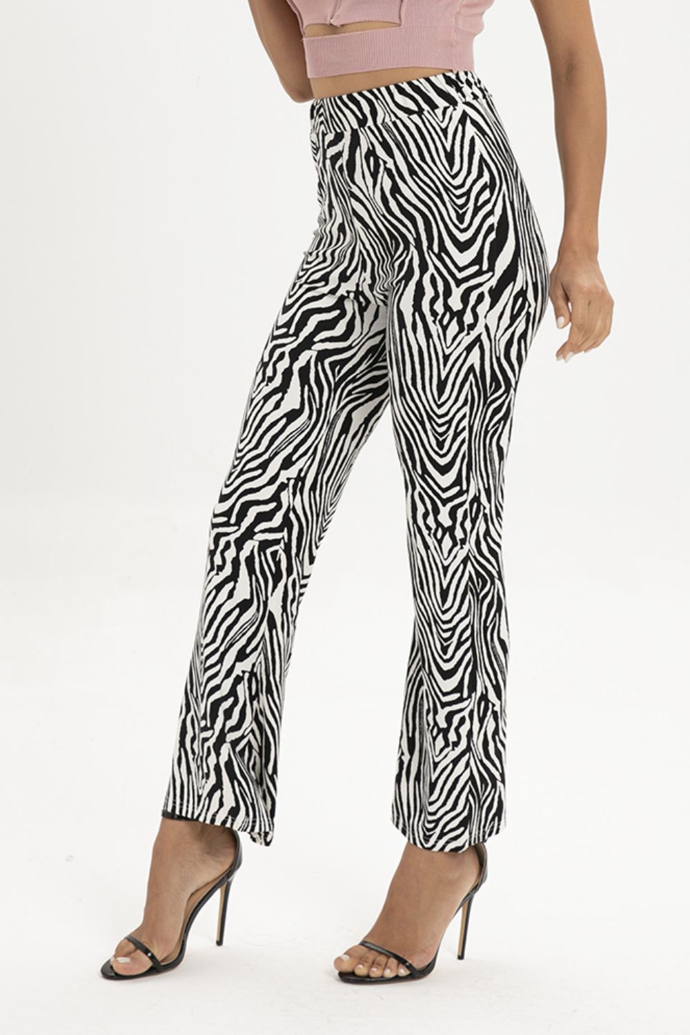 Zebra print flared leg trousers with a high waist.