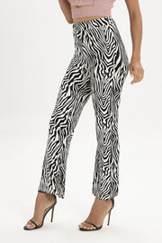 Zebra print flared leg trousers with a high waist.