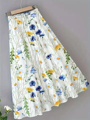 White A-line skirt with elastic waist and blue, yellow, and white floral print