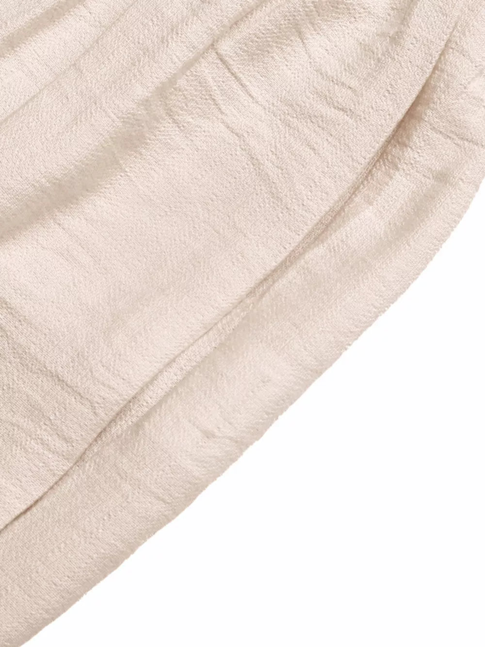 Luxe ruffled V-neck wide-leg romper in cream textured fabric