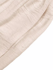 Luxe ruffled V-neck wide-leg romper in cream textured fabric