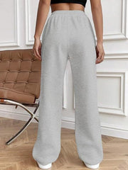 Gray pleated wide-leg lounge trousers with a relaxed fit.