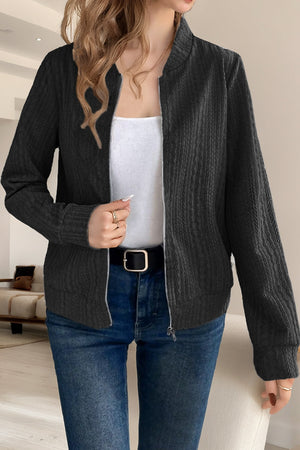 Textured ribbed bomber jacket in black with a zip front and casual cut.