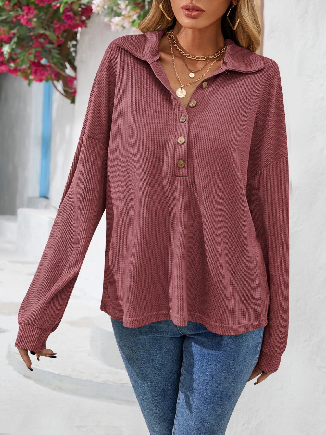 Waffle knit henley blouse in dusty blue with button placket and collar.