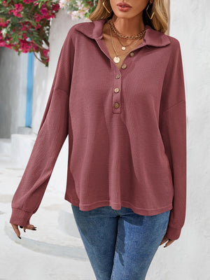 Waffle knit henley blouse in dusty blue with button placket and collar.