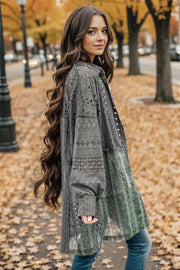 Charcoal lace panel shacket with voluminous sleeves and patchwork green lace hem.