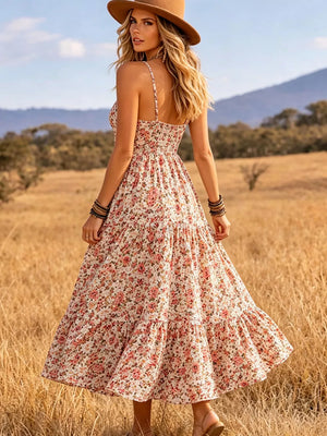 Floral V-neck midi dress with tiered skirt and spaghetti straps.