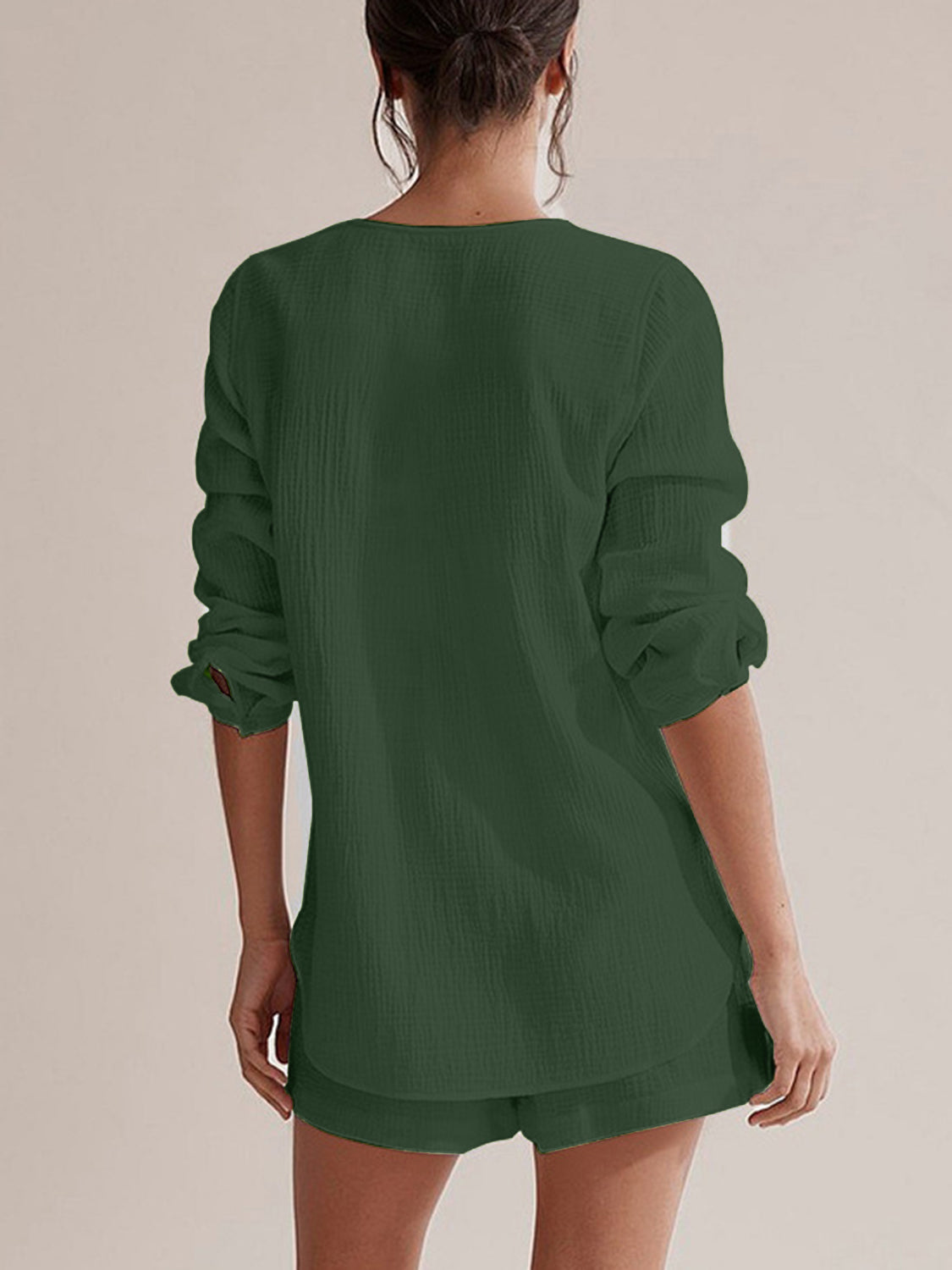 Textured cotton pajama set in dark green with long sleeves and shorts.