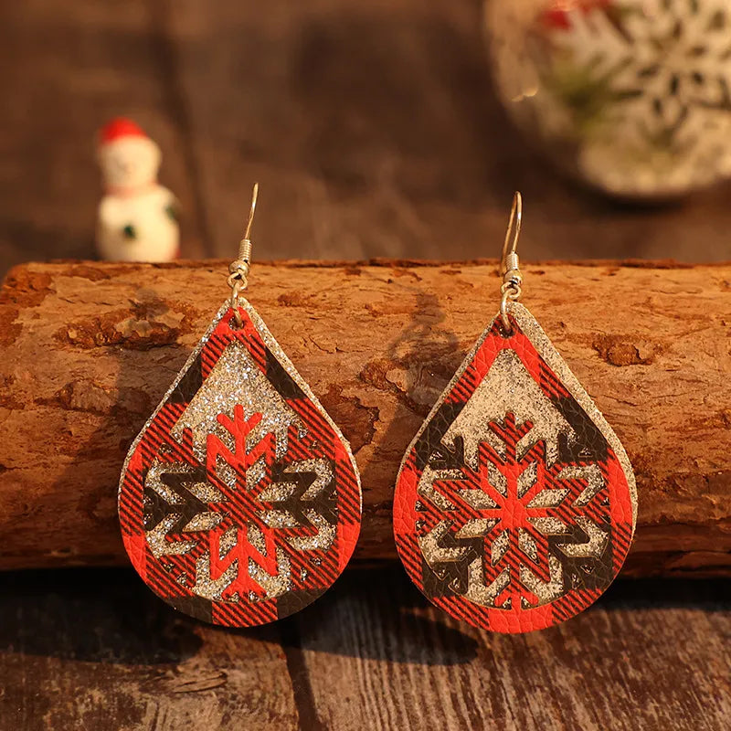 Plaid snowflake drop earrings in deep red with glitter accents.