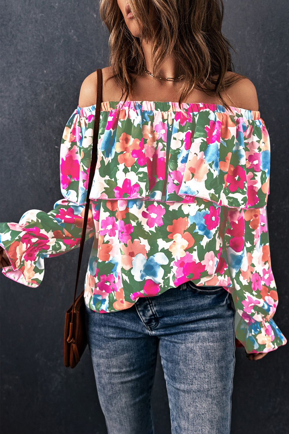 Floral ruffle off-shoulder poet blouse with long bell sleeves and a tiered bodice.