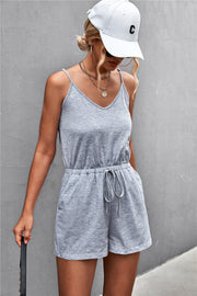 Gray Dawn V-neck drawstring romper with adjustable spaghetti straps and elastic waist.