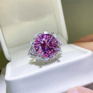 Radiant Blossom cocktail ring in silver with a large pink center stone and clear accent stones.