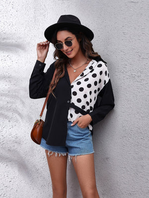 Checkerboard panel button-down shirt in black and white polka dot with a V-neck and long sleeves.