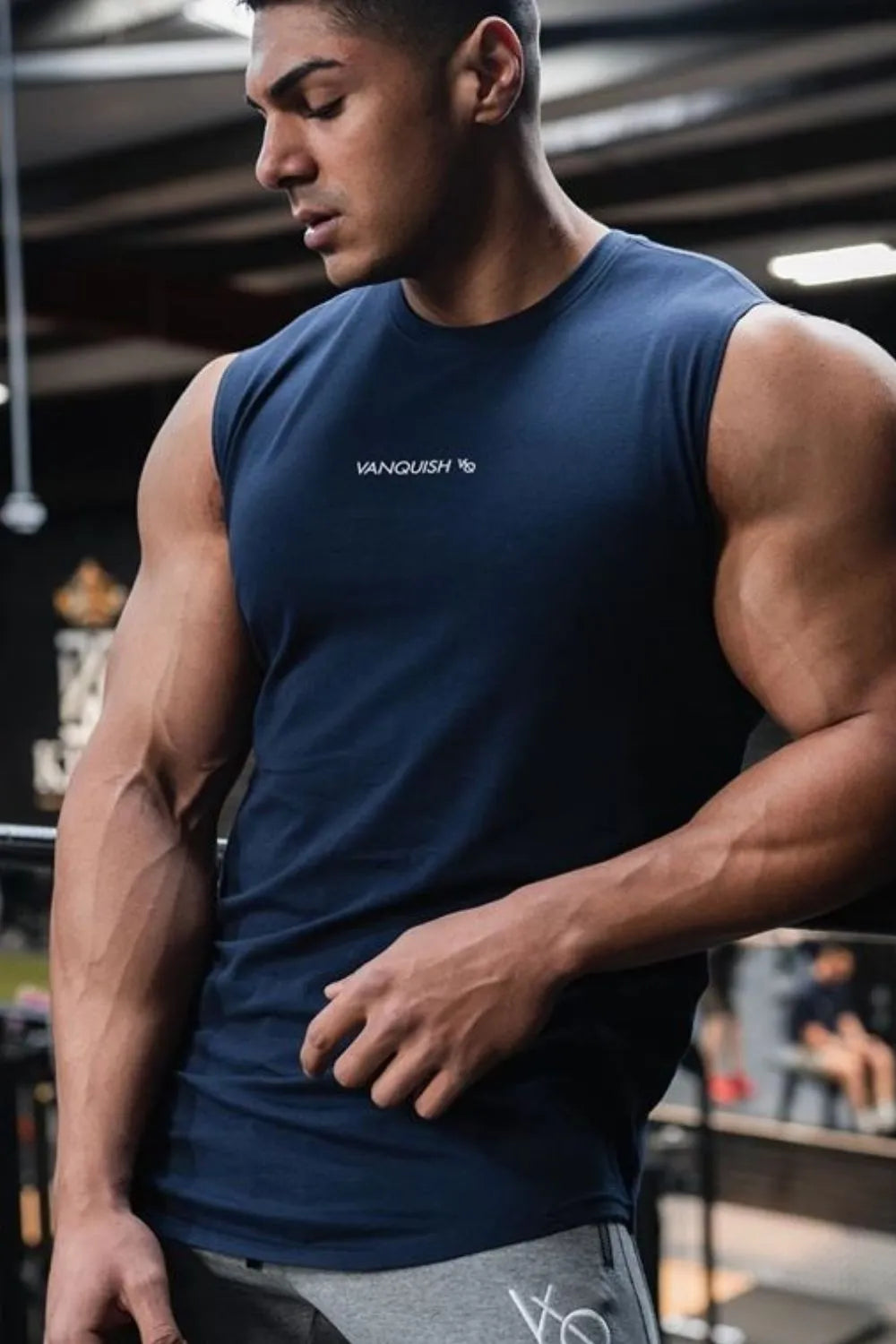 Navy performance tank top with subtle logo detail on chest