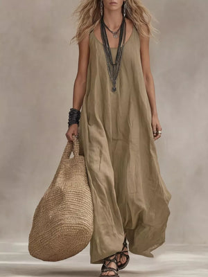 Khaki scoop neck maxi dress with flowing skirt and spaghetti straps.