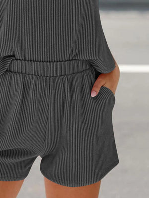 Dark gray ribbed sleeveless coord set with elastic waist shorts and pockets.