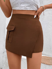 Brown asymmetric wrap-front high-waist shorts with a cargo pocket detail.
