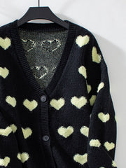 Black jacquard knit cardigan with allover heart pattern and button front.