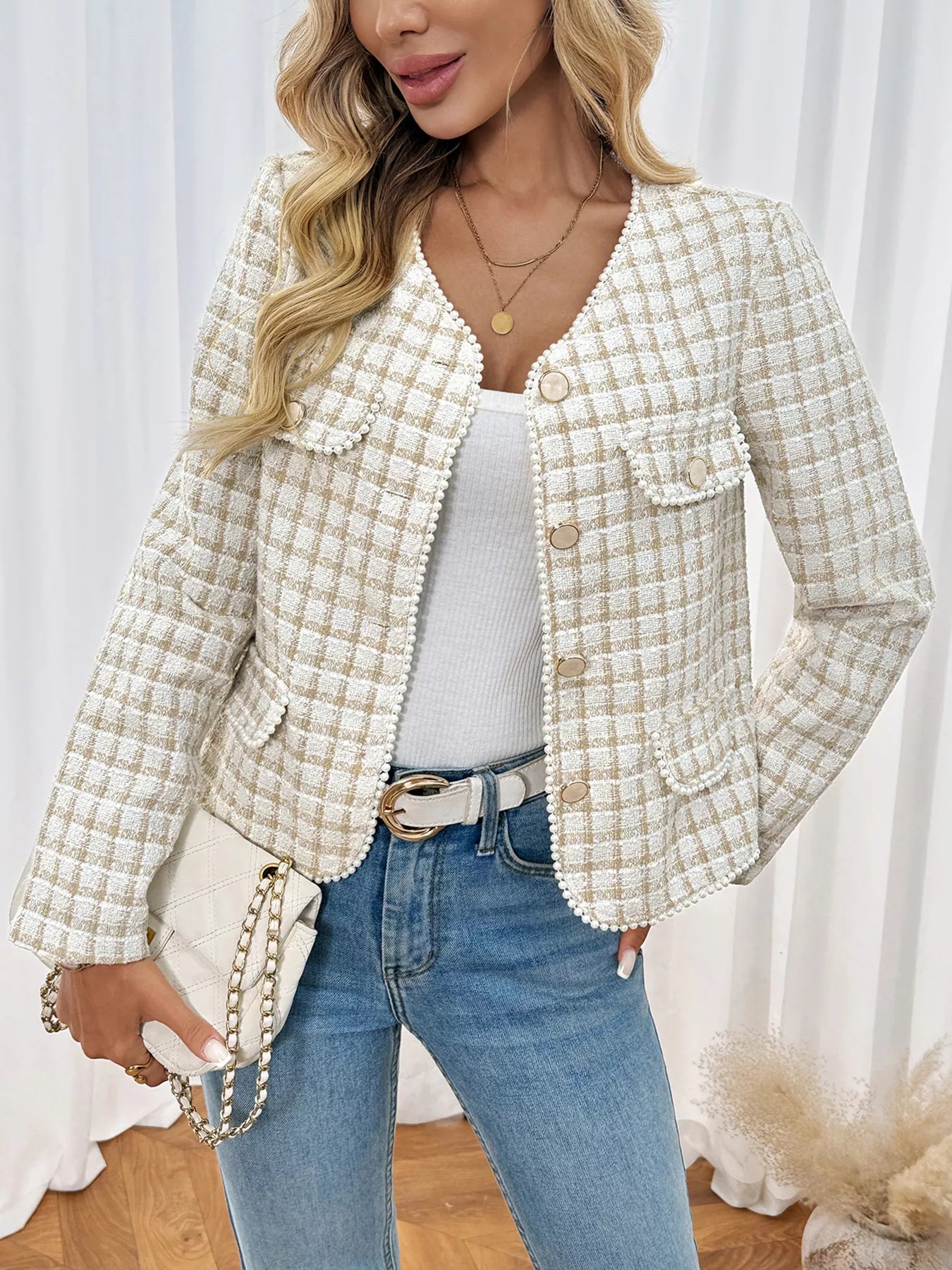 Apricot tweed jacket with pearl trim and button front, styled with jeans.